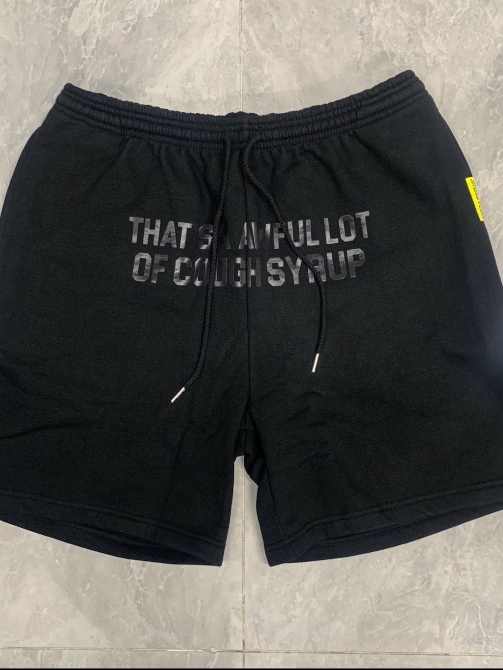 THAT’S A AWFUL LOT OF COUGH SYRUP shorts black